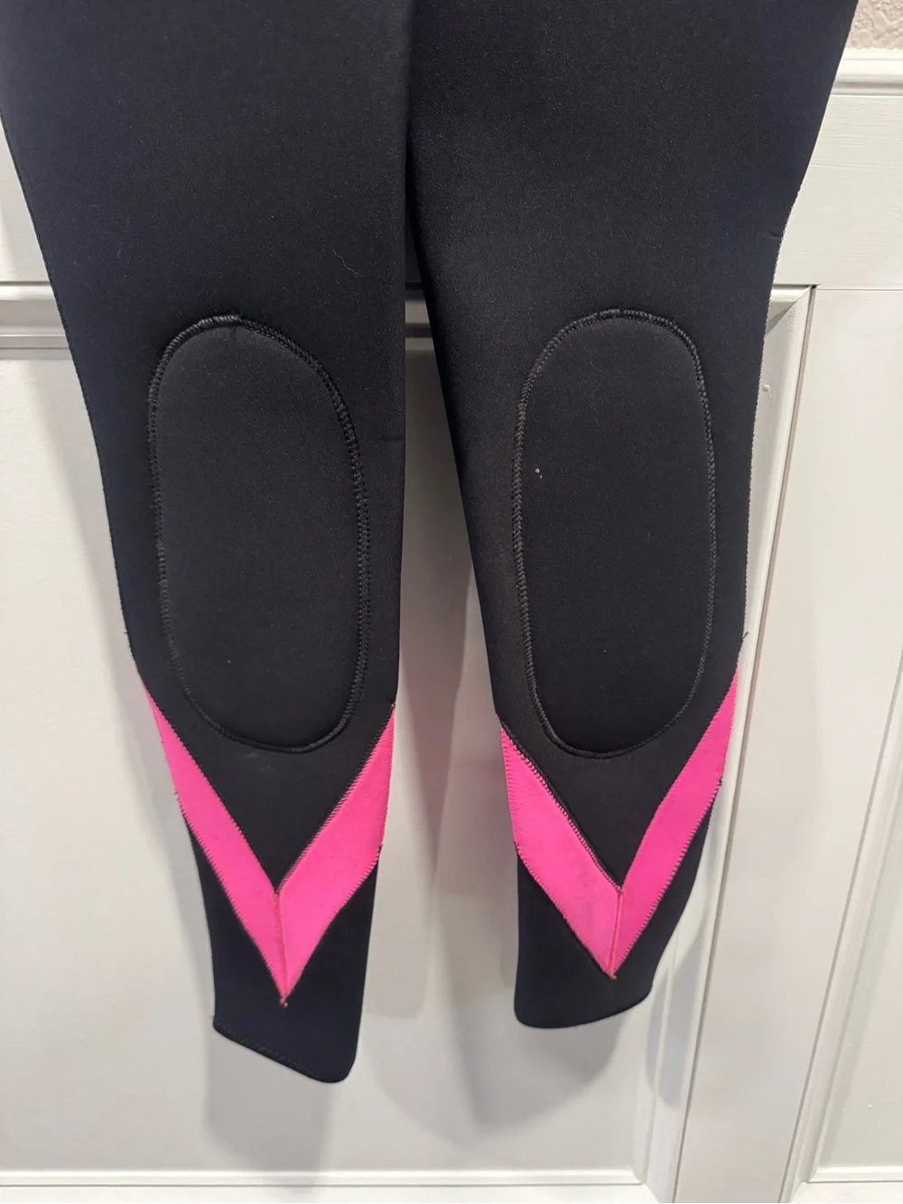 Black One-Piece Wetsuit with Pink Accents